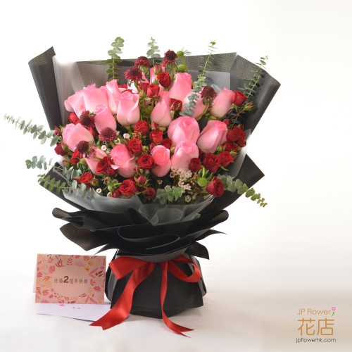Flowerg Flower's custom pink-themed bouquet with roses, wintersweet, spray roses, and eucalyptus, perfect for birthdays and expressing love.